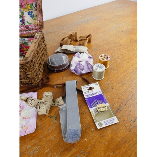 153 - A vintage sewing box and contents.