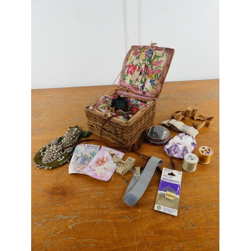 153 - A vintage sewing box and contents.