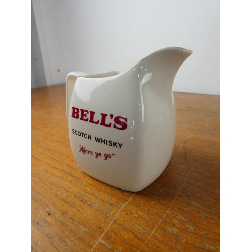 160 - A vintage Wade Bell's Scotch Whiskey jug.