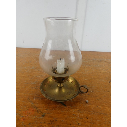 167 - A metal base candle holder with glass shade.