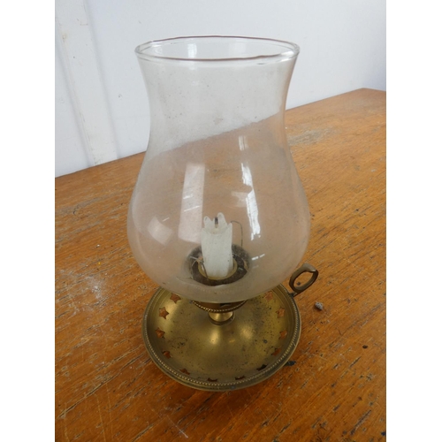 167 - A metal base candle holder with glass shade.