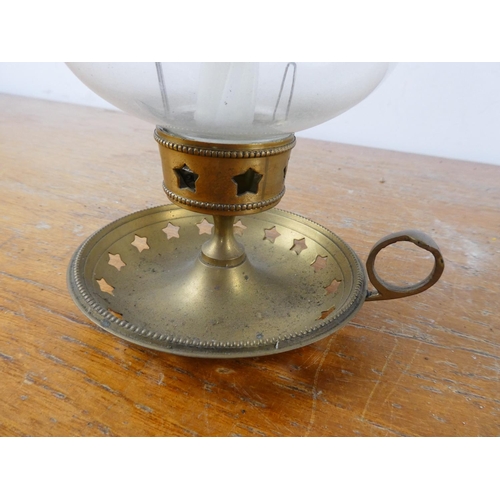 167 - A metal base candle holder with glass shade.