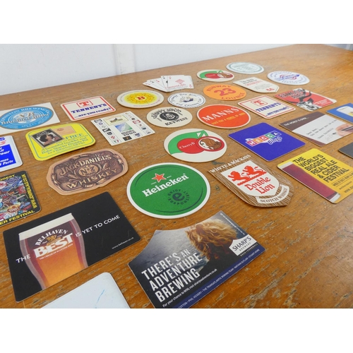 183 - A collection of vintage beer mats.