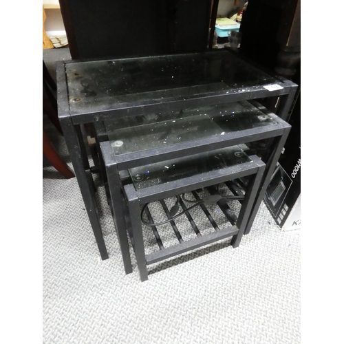 188 - A nest of three metal framed tables, largest measuring 21