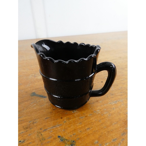 207 - A vintage glass sugar bowl and milk jug.