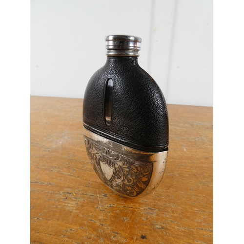 209 - A stunning antique leather and silver plate hip flask.