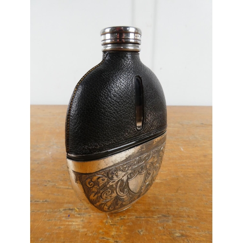 209 - A stunning antique leather and silver plate hip flask.