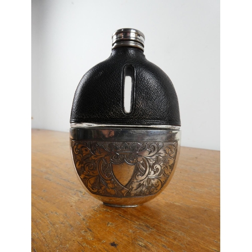 209 - A stunning antique leather and silver plate hip flask.