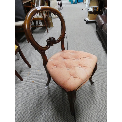 219 - A stunning antique oak balloon back chair.