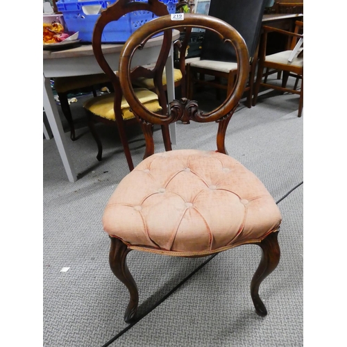 219 - A stunning antique oak balloon back chair.