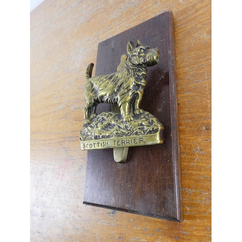 225 - A large 'Scottish Terrier' brass door knocker.