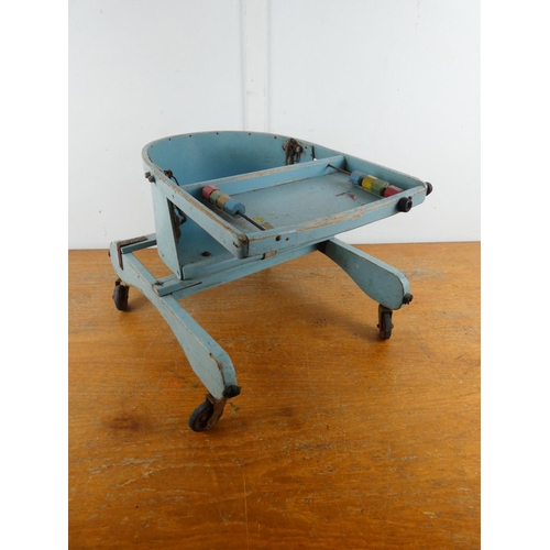 234 - A stunning vintage Triang child's walker.