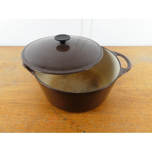 244 - A large vintage 'Cousances' 28 lidded cast iron cooking pot.