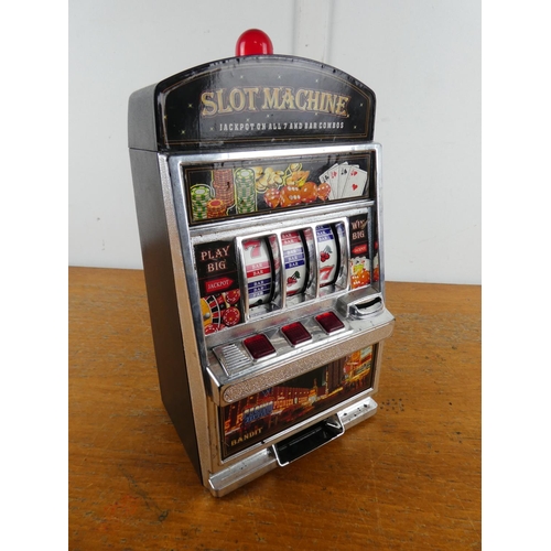 266 - A battery operated slot machine (a/f).