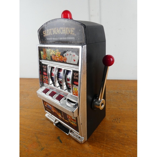 266 - A battery operated slot machine (a/f).