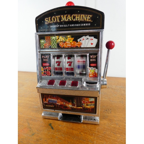 266 - A battery operated slot machine (a/f).