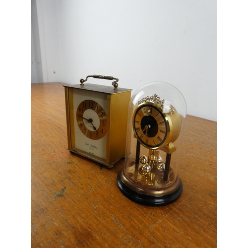 270 - A vintage Estyma mantle clock and another.