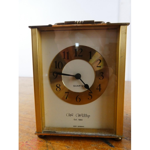 270 - A vintage Estyma mantle clock and another.