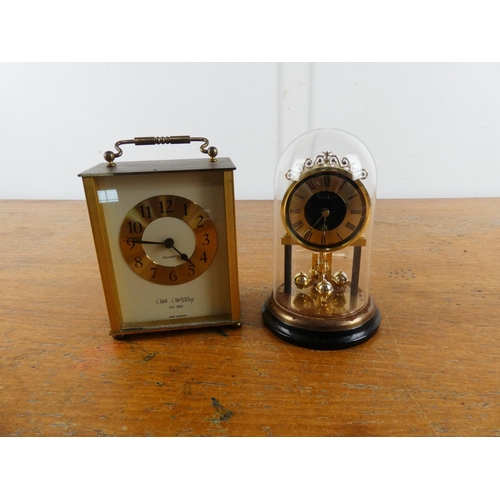 270 - A vintage Estyma mantle clock and another.