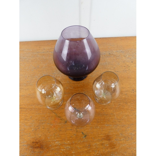 279 - A large purple glass goblet and three others.