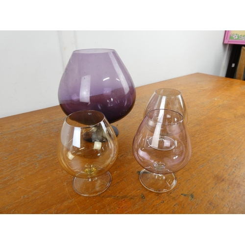 279 - A large purple glass goblet and three others.