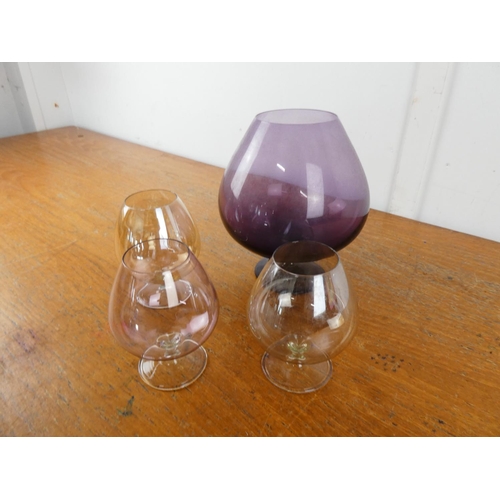 279 - A large purple glass goblet and three others.