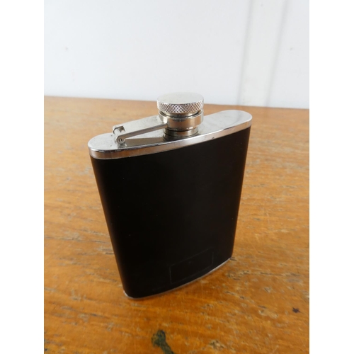 28 - A leather cased stainless steel hip flask.