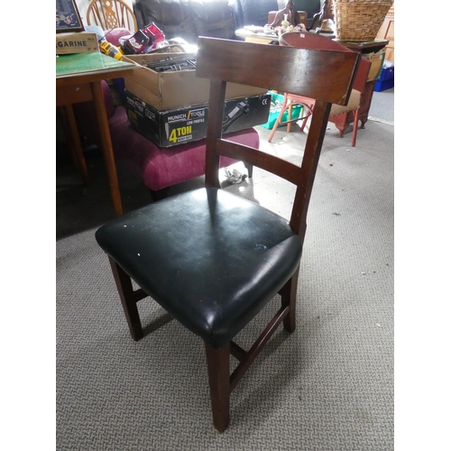 285 - An antique mahogany rail back chair with green leather upholstery.