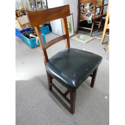 285 - An antique mahogany rail back chair with green leather upholstery.