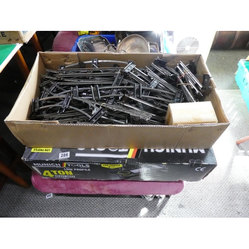 286 - Two large boxes of Hornby train track and a box of Honby connecting plates.