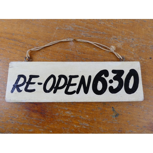 316 - A 'Re-Open 1.30' wooden door sign.