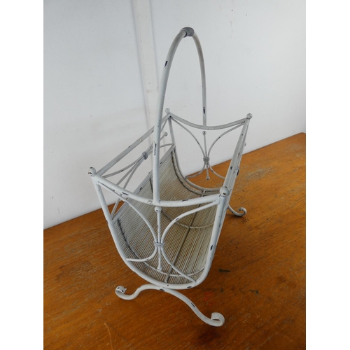 33 - A metal magazine rack.