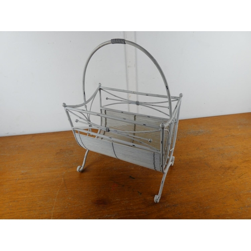 33 - A metal magazine rack.