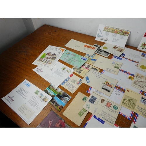 348 - A lot of first day covers, postcards and more.