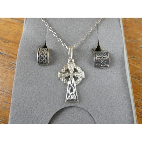 356 - A sterling silver Celtic cross necklace and two ear cuffs.