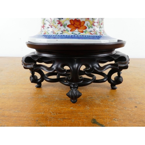 360 - A stunning large Chinese scroll dish on a wooden stand.