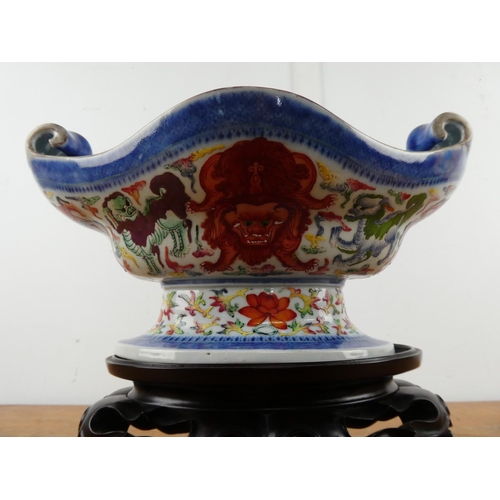 360 - A stunning large Chinese scroll dish on a wooden stand.