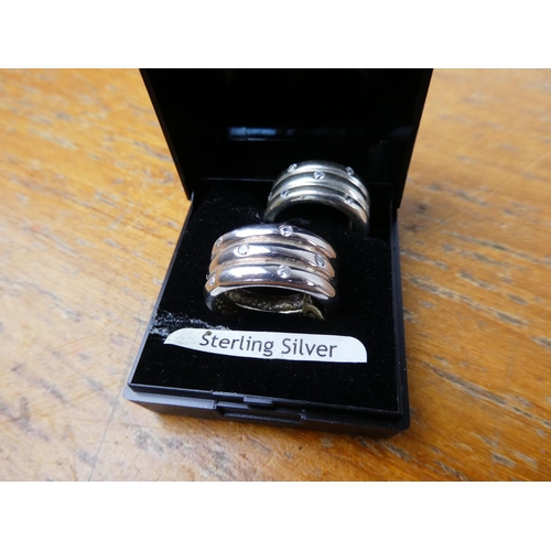 362 - A pair of sterling silver and crystal rings