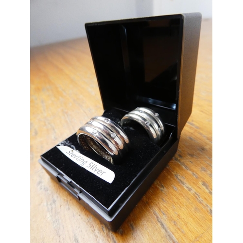 362 - A pair of sterling silver and crystal rings