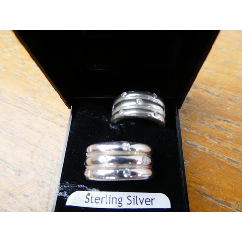 362 - A pair of sterling silver and crystal rings