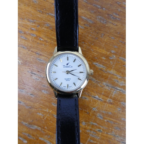 382 - A Guess replica wrist watch and two others.