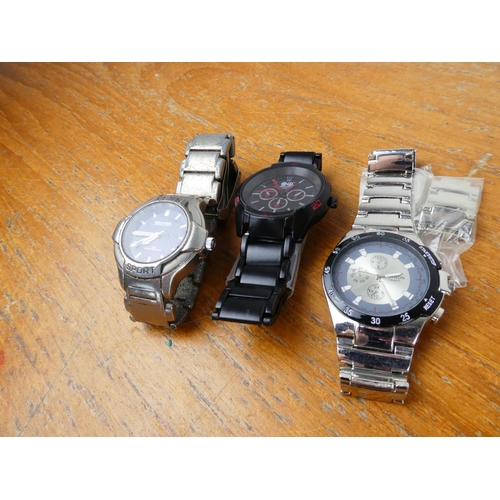 386 - A Citron wrist watch and two others.