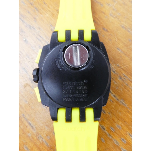 387 - A yellow Swatch wrist watch.