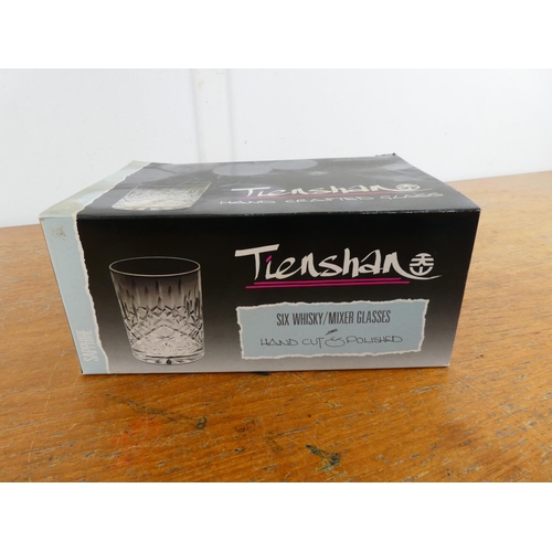 43 - A boxed set of six vintage Tienshan whiskey glasses.
