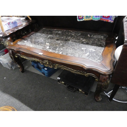 68 - A stunning large mahogany coffee table with carved detail and a marble effect top, measuring 49