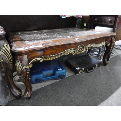 68 - A stunning large mahogany coffee table with carved detail and a marble effect top, measuring 49