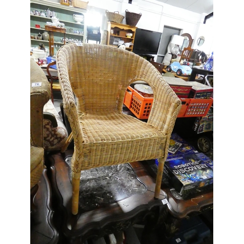 75 - A vintage wicker chair.