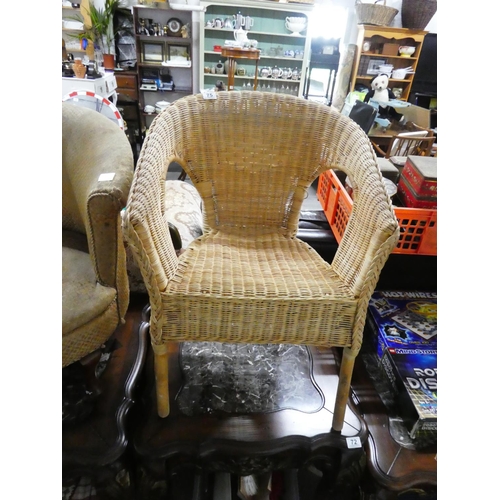 75 - A vintage wicker chair.