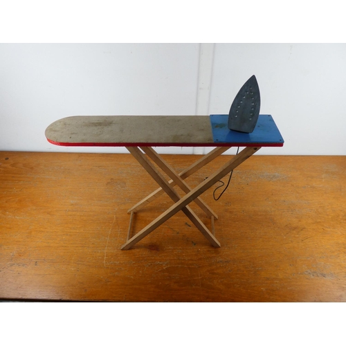 92 - A vintage toy ironing board and iron.