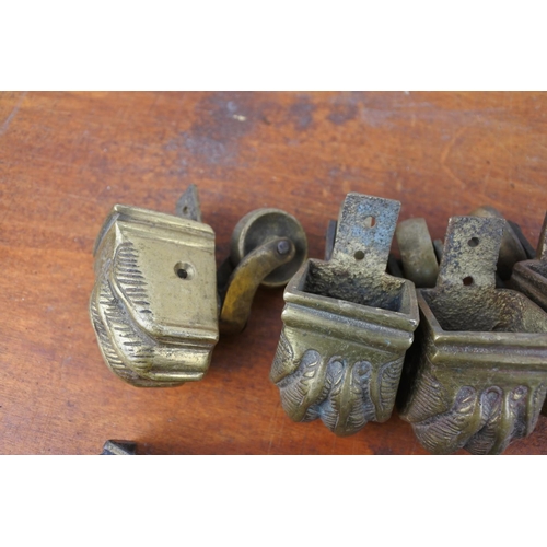 419 - A large lot of antique brass casters for furniture.